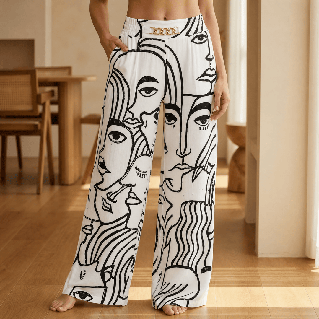 Women's wide leg trousers with gold chain detail in face print
