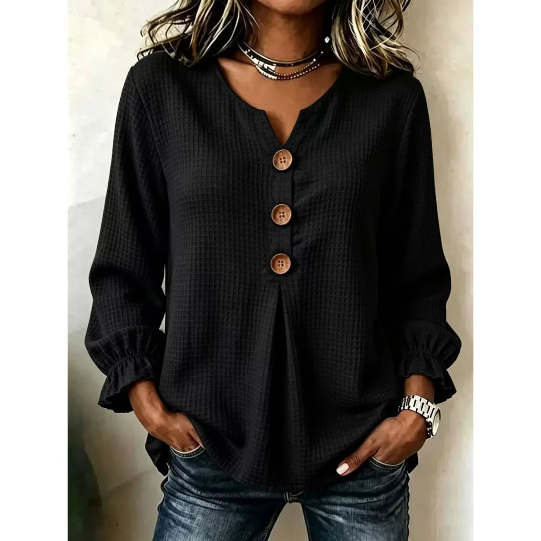 Women's waffle knit long sleeve top with ruffle detail in black